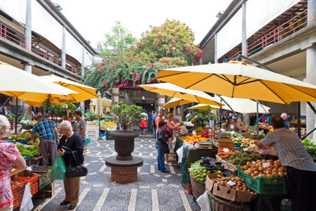 FUNCHAL, PORTUGAL - JUNE 14, 2013: People visit the famous market Mercado dos Lavradores in Funchal, capital city of Madeira island, Portugalのeditorial素材
