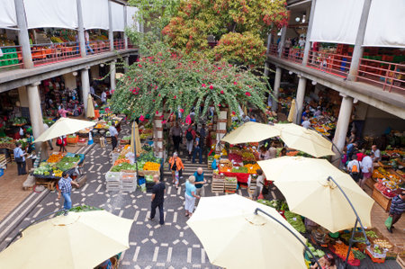 FUNCHAL, PORTUGAL - JUNE 14, 2013: People visit the famous market Mercado dos Lavradores in Funchal, capital city of Madeira island, Portugalのeditorial素材