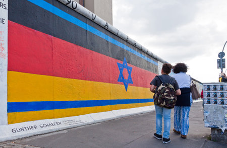 BERLIN, GERMANY - JULY 2, 2014: Fragment of East Side Gallery in Berlin. It is a 1.3 km long part of original Berlin Wall which collapsed in 1989 and now is the largest world graffiti galleryのeditorial素材