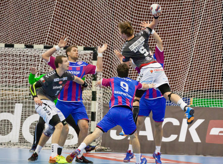 KYIV, UKRAINE - OCTOBER 18, 2014: Sander Sagosen of Aalborg (#5) attacks during European Handball Champions League game against Motorのeditorial素材