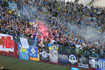 WARSAW, POLAND - MAY 27, 2015: FC Dnipro team ultra supporters ultras show their support during UEFA Europa League Final game against Sevilla at Warsaw National Stadiumのeditorial素材