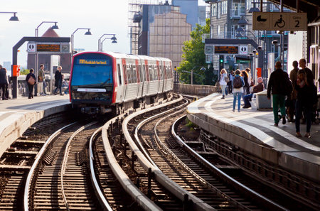 HAMBURG, GERMANY - JULY 25, 2014: Passengers waiting train at Baumwall U-Bahn Station in Hamburg. Hamburg U-Bahn Metro Rapid Transit System was opened in 1912 and comprises 4 lines with 91 stationsのeditorial素材