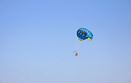 SOPOT, POLAND - JULY 26, 2015: People enjoy paragliding in the sky of Sopot resort, Polandのeditorial素材
