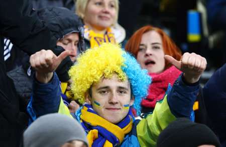 LVIV, UKRAINE - NOVEMBER 14, 2015: Ukrainian supporters show their support during UEFA EURO 2016 Play-off for Final Tournament game between Ukraine and Slovenia at Lviv Arenaのeditorial素材