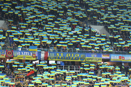 LVIV, UKRAINE - NOVEMBER 14, 2015: Ukrainian supporters show their support during UEFA EURO 2016 Play-off for Final Tournament game between Ukraine and Slovenia at Lviv Arenaのeditorial素材