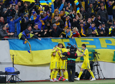 LVIV, UKRAINE - NOVEMBER 14, 2015: Ukrainian footballers react after scored a goal during UEFA EURO 2016 Play-off for Final Tournament game against Slovenia at Lviv Arenaのeditorial素材