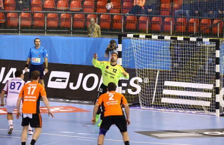 KYIV, UKRAINE - NOVEMBER 28, 2015: Barys Pukhouski of Motor L, 87 throws the penalty kick during VELUX EHF Champions League 201516 Handball game against Kadetten Schaffhausenのeditorial素材