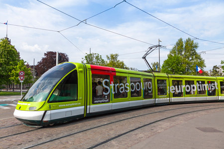 STRASBOURG, FRANCE - MAY 6, 2013: Modern tram model Eurotram on a street of Strasbourg, Alsace region, France. Current tramway network has 6 lines with a total route length of 40.7 kmのeditorial素材