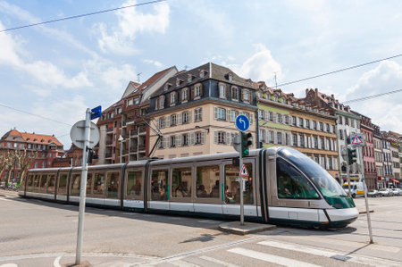 STRASBOURG, FRANCE - MAY 6, 2013: Modern tram model Eurotram on a street of Strasbourg, Alsace region, France. Current tramway network has 6 lines with a total route length of 40.7 kmのeditorial素材
