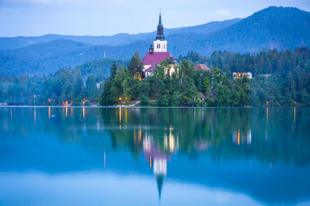 Atmospheric picturesque view of Church of the Assumption on the island of Bled lake, Sloveniaのeditorial素材