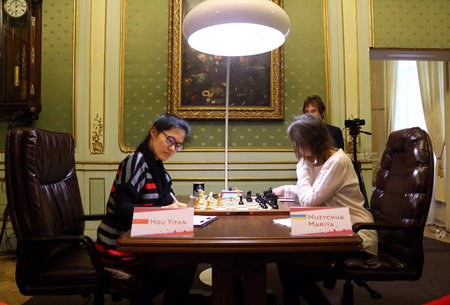 LVIV, UKRAINE - MARCH 11, 2016: 7th game of FIDE Women's World Chess Championship Match between Mariya Muzychuk (Ukraine) and Hou Yifan (China) in Potocki Palace, Lviv, Ukraineのeditorial素材