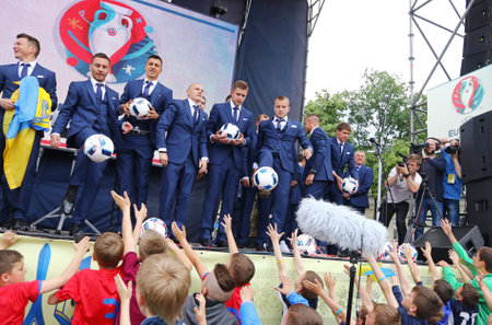 KYIV, UKRAINE - MAY 22, 2016: Players of the National Football team of Ukraine handing out soccer balls to supporters at the Ceremony of the Departure for the European Championship 2016のeditorial素材