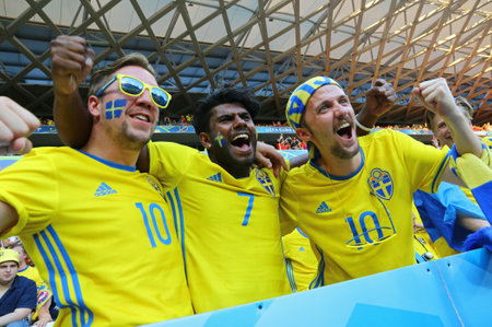 NICE, FRANCE - JUNE 22, 2016: Swedish fans show their support during the UEFA EURO 2016 game Sweden v Belgium at Allianz Riviera Stade de Nice, Nice, France. Belgium won 1-0のeditorial素材