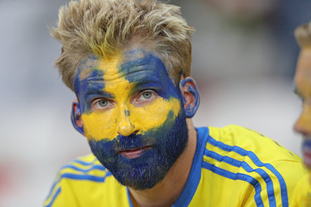 NICE, FRANCE - JUNE 22, 2016: Swedish fan reacts after his team lost the UEFA EURO 2016 game against Belgium at Allianz Riviera Stade de Nice, Nice, France. Belgium won 1-0のeditorial素材