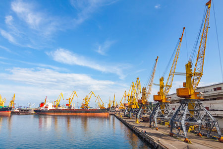 Lifting cargo cranes and ships in sea port of Odessa, Black Sea, Ukraineのeditorial素材