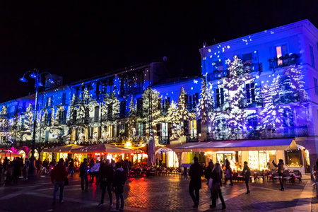 COMO, ITALY - DECEMBER 2, 2016: Festive Christmas decorations lights on facades of buildings on Piazza Duomo (Cathedral Square) in center of Como old town, Lombardy, Italyのeditorial素材