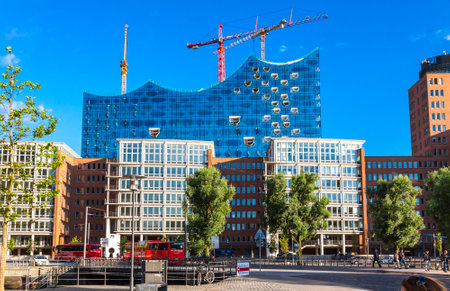 HAMBURG, GERMANY - JUNE 25, 2014: City of Warehouses district (Speicherstadt) in Hamburg, Germany. Building of Elbphilharmonie (Elbe Philharmonic Hall) on the backgroundのeditorial素材