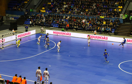 KYIV, UKRAINE - JANUARY 29, 2017: Players of Spain (in White) and Ukraine (in Blue) teams in action during their Friendly Futsal match at Palats of Sports in Kyiv, Ukraineのeditorial素材