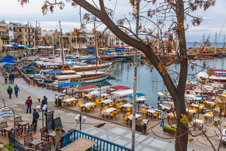 KYRENIA, CYPRUS - JANUARY 19, 2015: Winter view of Kyrenia old harbour in Northern Cyprus. Kyrenia (Turkish: Girne) is a city on the northern coast of Cyprus, noted for its historic harbour and castleのeditorial素材