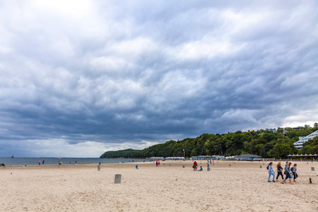 GDYNIA, POLAND - JULY 31, 2015: Municipal beach in Gdynia city, Baltic sea, Poland. Cloudy summer dayのeditorial素材