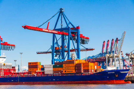 HAMBURG, GERMANY - JUNE 25, 2014: Docks of Port of Hamburg (Hamburger Hafen) on the river Elbe, Germany. The largest port in Germany and one of the busiest ports in Europeのeditorial素材