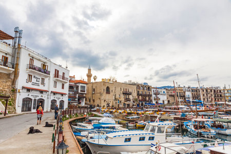 KYRENIA, CYPRUS - JANUARY 19, 2015: Winter view of Kyrenia old harbour in Northern Cyprus. Kyrenia (Turkish: Girne) is a city on the northern coast of Cyprus, noted for its historic harbour and castleのeditorial素材
