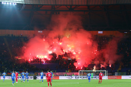 Kharkiv, Ukraine - November 15, 2016: Ukrainian ultra supporters (ultras) burn flares during Friendly match between Ukraine and Serbia at Metalist stadium in Kharkiv, Ukraine. Ukraine won 2-0のeditorial素材