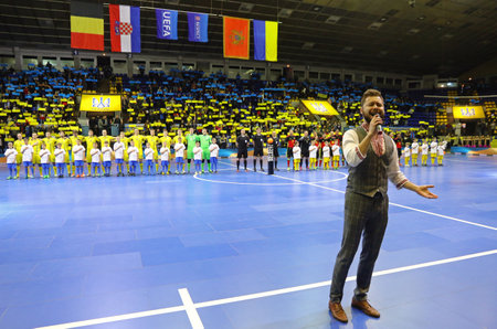 KYIV, UKRAINE - APRIL 8, 2017: National Futsal Teams of Ukraine and Belgium listen to National anthems before their UEFA Futsal Euro 2018 qualifying game at Palats of Sports in Kyiv, Ukraineのeditorial素材