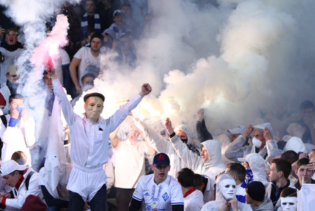 KYIV, UKRAINE - APRIL 21, 2017: Unidentified FC Dynamo Kyiv supporter wearing Vladimir Putin's mask with nazi symbols performs during Ukrainian Premier League game against Shakhtar Donetskのeditorial素材