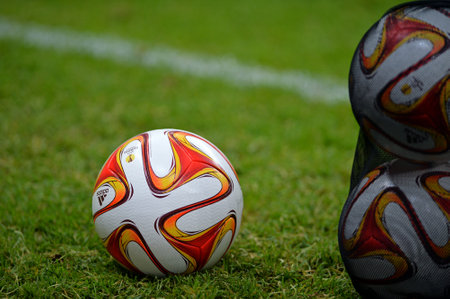 WARSAW, POLAND - MAY 27, 2015: Official UEFA Europa League match ball on the grass during Training...
