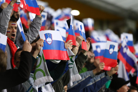 MARIBOR, SLOVENIA - NOVEMBER 17, 2015: Slovenian supporters show their support during UEFA EURO 2016 Play-off for Final Tournament game Slovenia v Ukraine at Stadion Ljudski vrt in Maribor, Sloveniaのeditorial素材