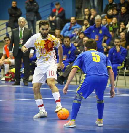KYIV, UKRAINE - JANUARY 29, 2017: Rafa Usin of Spain (L) fights for a ball with Petro Shoturma of Ukraine during their Friendly Futsal match at Palats of Sports in Kyiv, Ukraineのeditorial素材
