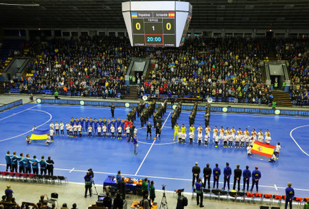 KYIV, UKRAINE - JANUARY 29, 2017: National Futsal Team of Ukraine (Left) and Spain listen to National anthems during their friendly Futsal match at Palats of Sports in Kyiv, Ukraineのeditorial素材