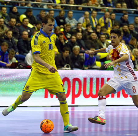 KYIV, UKRAINE - JANUARY 28, 2017: Dmytro Sorokin of Ukraine (L) controls a ball during friendly Futsal match against Spain at Palats of Sports in Kyiv, Ukraineのeditorial素材