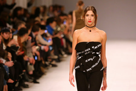 KYIV, UKRAINE - FEBRUARY 3, 2018: Models present a creation by designer DOMANOF during 42nd Ukrainian Fashion Week season Fall/Winter 2018/19 at Mystetskyi Arsenal in Kyiv, Ukraineのeditorial素材