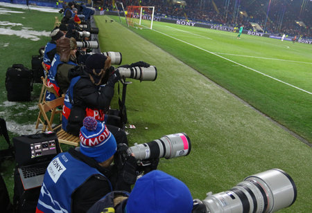 KHARKIV, UKRAINE - FEBRUARY 21, 2018: Sport photographers at work during UEFA Champions League Round of 16 game Shakhtar v Roma at OSK Metalist stadium in Kharkiv, Ukraineのeditorial素材
