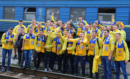 KHARKIV, UKRAINE - SEPTEMBER 2, 2017: Ukrainian National Football Team supporters pose for a group photo on the Kharkiv Railway station before the FIFA World Cup 2018 qualifying game Ukraine v Turkeyのeditorial素材