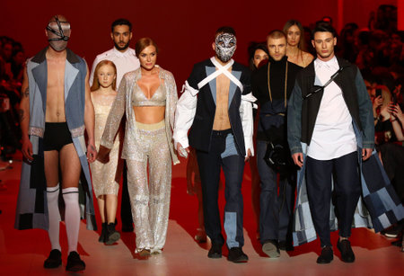 KYIV, UKRAINE - FEBRUARY 3, 2018: Models present a creation by designer GASANOVA during 42nd Ukrainian Fashion Week season Fall/Winter 2018/19 at Mystetskyi Arsenal in Kyiv, Ukraineのeditorial素材