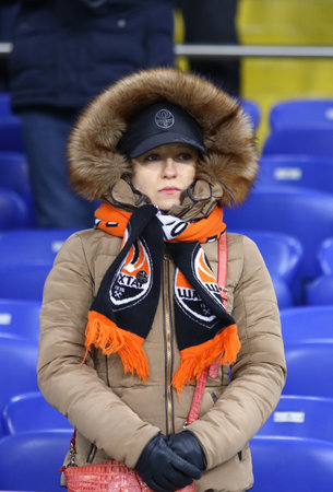 KHARKIV, UKRAINE - FEBRUARY 21, 2018: Shakhtar Donetsk supporter looks on the UEFA Champions League Round of 16 game against AS Roma on tribunes of OSK Metalist stadium in Kharkivのeditorial素材