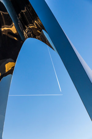 COMO, ITALY - DECEMBER 2, 2016: View of Stainless steel sculpture Life Electric created by Daniel Libeskind on Lake Como in Como city. Trails of airplanes in the sky on backgroundのeditorial素材