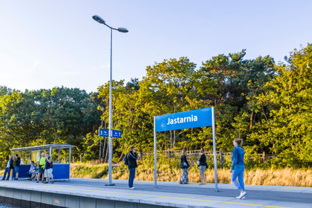 JASTARNIA, POLAND - AUGUST 1, 2015: People waiting train at Jastarnia Wczasy railway station, small station serving the town of Jastarnia, in Pomeranian Voivodeship, Polandのeditorial素材