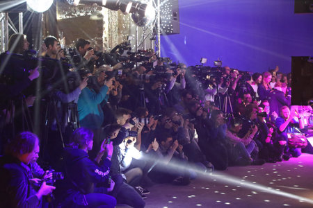 KYIV, UKRAINE - FEBRUARY 3, 2018: Photographers at work during the fashion presentation by POUSTOVIT...