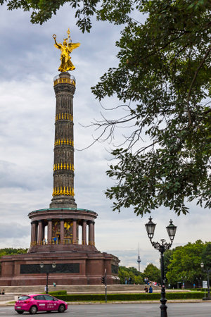 BERLIN, GERMANY - JUNE 30, 2014: Victory Column, famous sight in Berlin city, Germany. Impressive Siegessaule monument with golden angel on topのeditorial素材