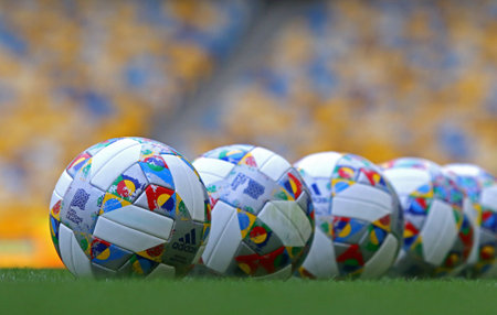 KYIV, UKRAINE - SEPTEMBER 4, 2018: Adidas Nations League, official match balls of UEFA Nations League 2018/2019 on the grass. Ball has colorful design elements inspired by official Nations League flagのeditorial素材