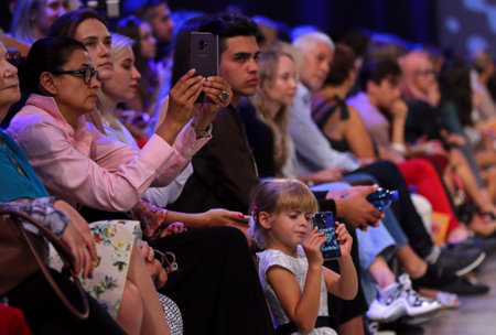 KYIV, UKRAINE - SEPTEMBER 3, 2018: People watch the Fashion Show by designer KATERINA KVIT as part...
