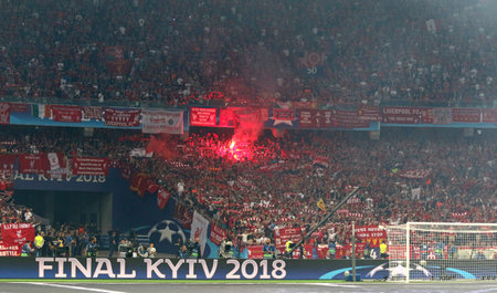 KYIV, UKRAINE - MAY 26, 2018: Liverpool supporters burn flares during the UEFA Champions League Final 2018 game against Real Madrid at NSC Olimpiyskiy Stadium in Kyiv. Real Madrid won 3-1のeditorial素材