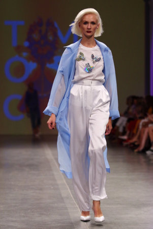 KYIV, UKRAINE - SEPTEMBER 3, 2018: Model presents a creation by designer T.MOSCA during Ukrainian Fashion Week Spring/Summer 2019 at Mystetskyi Arsenal in Kyiv, Ukraineのeditorial素材