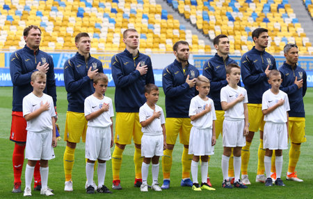 LVIV, UKRAINE - SEPTEMBER 9, 2018: Ukrainian players listen to the National Anthem before the UEFA Nations League game Ukraine v Slovakia at Arena Lviv stadium in Lviv, Ukraineのeditorial素材