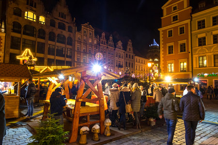 WROCLAW, POLAND - DEC 7, 2017: Christmas market on Market square (Rynek) in Wroclaw, Poland. One of Poland's best and largest Christmas markets, stretching across two sides of Wroclaw's market squareのeditorial素材