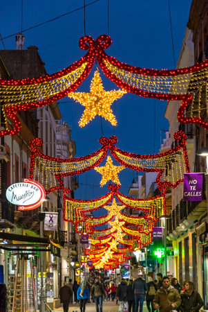 RONDA, SPAIN - DECEMBER 13, 2017: Christmas decorations on the Carrera Espinel street in center of Ronda old town, Malaga province, Andalusia, Spainのeditorial素材